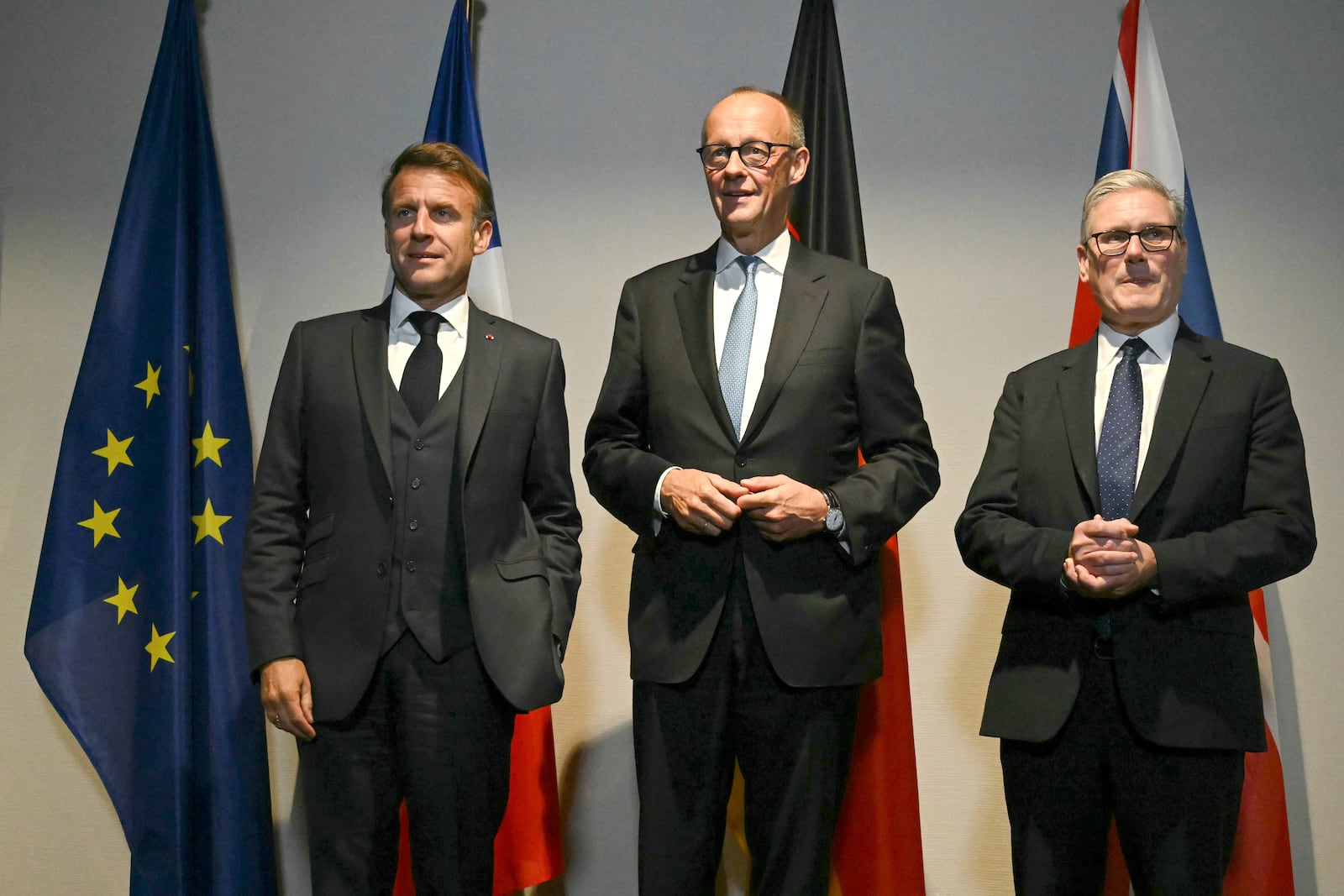 From left, France's President Emmanuel Macron, Germany's Chancellor Friedrich Merz and Britain's Prime Minister Keir Starmer pose as they meet on the sidelines of the two-day NATO's Heads of State and Government summit in The Hague, Tuesday, June 24, 2025. (Ben Stansall/Pool Photo via AP)