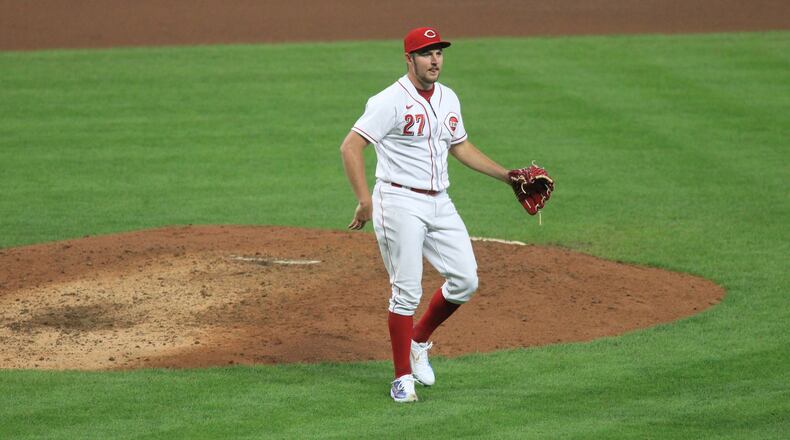 Reds starter Trevor Bauer celebrates after the final out of the seventh inning against the Brewers on Wednesday, Sept. 23, 2020, at Great American Ball Park in Cincinnati. David Jablonski/Staff