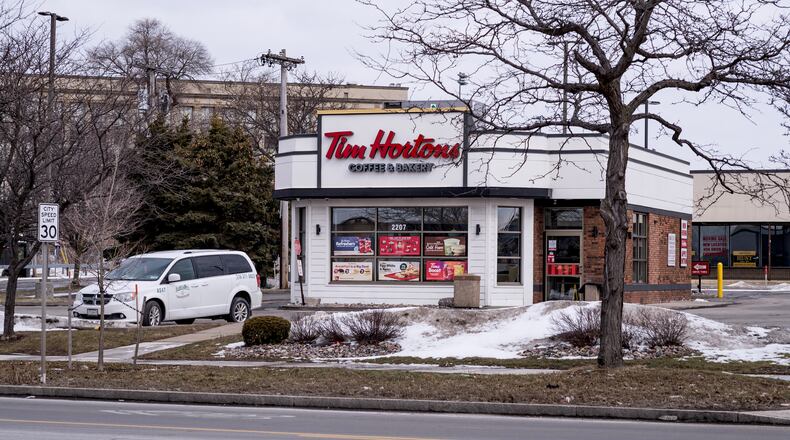 A vehicle rests in the parking lot of a Tim Horton's Coffee and Bakery shop, Friday, Feb. 27, 2026, in Buffalo, N.Y., the site where Nurul Amin Shah Alam, was dropped off after being released by Border Patrol agents last week. (AP Photo/Craig Ruttle)