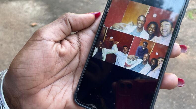 Radio host Siima Kyakuhaire Sabiti shows old pictures of her with New York Mayor-elect Zohran Mamdani during his 2019 visit to her show in Kampala, Uganda, Wednesday, Nov. 5, 2025. (AP Photo/Hajarah Nalwadda )