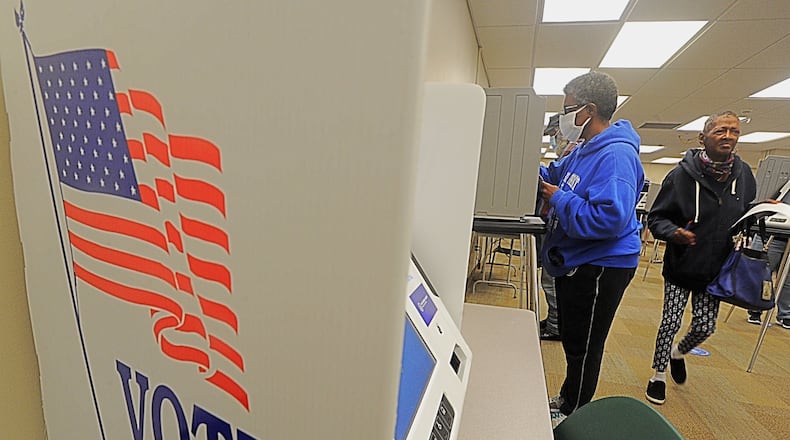 Long lines greeted voters at the Montgomery County Board of Elections on Tuesday, Oct. 6, 2020, as early voting began for the November general election. Early in-person voting in the state lasts until Nov. 2 and absentee ballots can be dropped off at the board office until Election Day, which is Nov. 3. In Montgomery County, registered voters can cast their ballot at the board of elections located at 451 W. Third St. in Dayton. MARSHALL GORBY/STAFF
