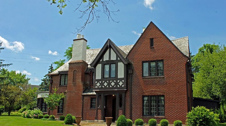 This stately brick home offers approximately 3,360 sq. ft. of living space with 4 bedrooms and a sunroom. The house also has a 3 ½-car garage. CONTRIBUTED PHOTO BY VICKIE KAPNAS