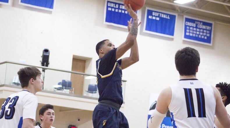 Springfield’s RaHeim Moss puts up a shot Friday night at Springboro. The Wildcats survived the upset bid for a 34-32 victory. Jeff Gilbert/CONTRIBUTED