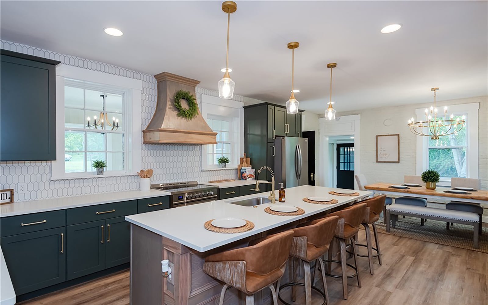 The completely renovated kitchen has LVT flooring, quartz countertops, range hood and all new appliances. The dining room is open to the kitchen. CONTRIBUTED