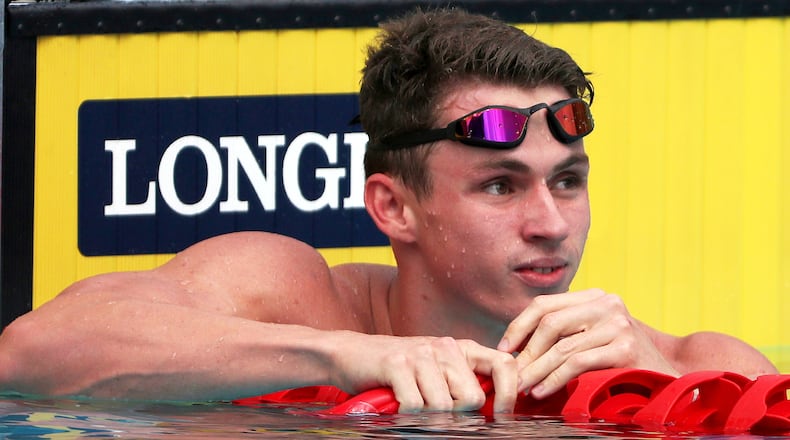 FILE - England's Ben Proud reacts after he was disqualified in his men's 50m butterfly heat during the 2018 Commonwealth Games at the Aquatic Centre on the Gold Coast, Australia, April 5, 2018. (AP Photo/Rick Rycroft, File)