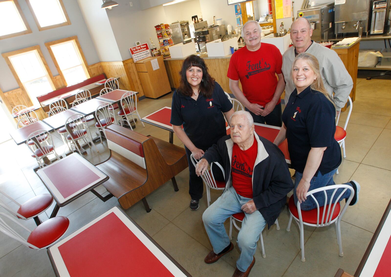 Orla Fent, front, opened the store with his wife. Behind him are Joy Carter, Jay Fent, contractor Tim Studebaker, and Rita Hall. The new building boasts seating for 54 customers, a larger parking lot and an expanded menu. Barbara J. Perenic/Staff