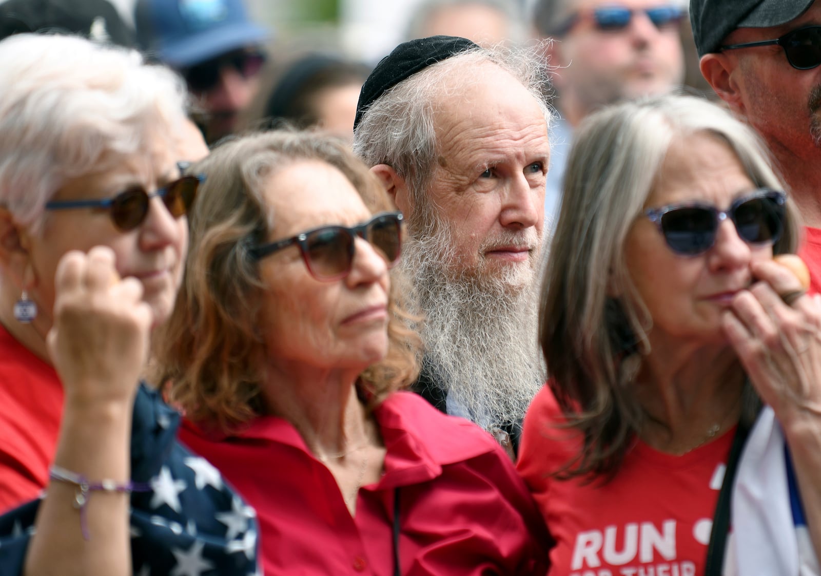 A group of people listen to speakers at a rally in Boulder, Colo.., on Sunday, June 8, 2025, calling for the release of Israeli hostages being held in Gaza. (AP Photo/Thomas Peipert)