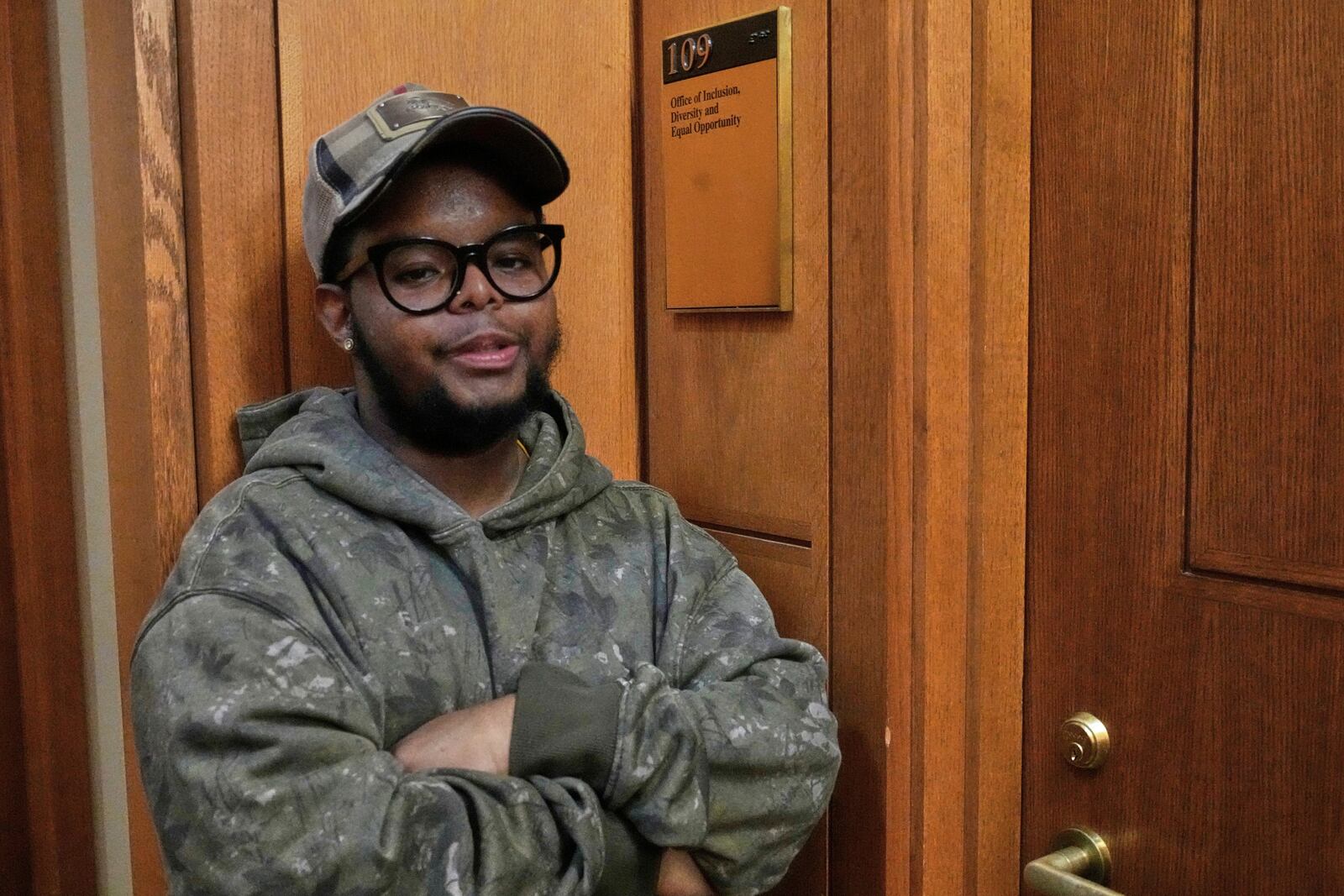 Case Western Reserve University student. Justen Pippens poses for a photo outside the recently closed Office of Inclusion, Diversity and Equal Opportunity at the school In Cleveland Thursday, April 17, 2025. (AP Photo/Sue Ogrocki)