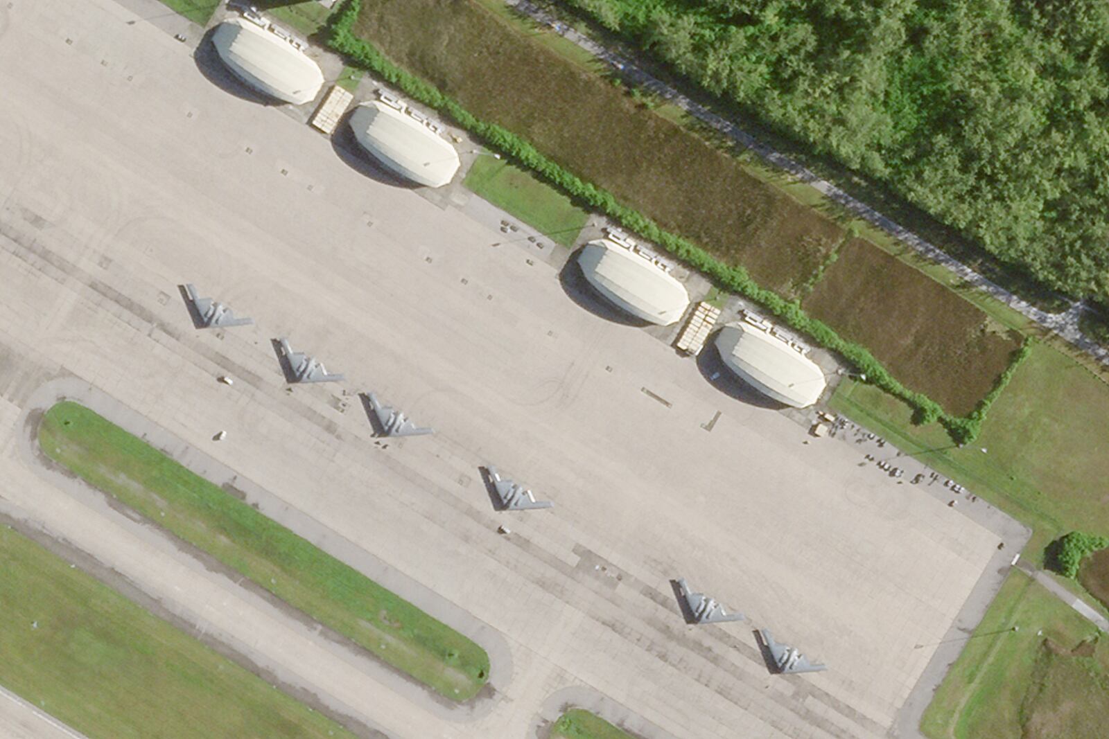 This satellite photo from Planet Labs PBC shows six B-2 stealth bombers parked at Camp Thunder Cove in Diego Garcia on Wednesday, April 2, 2025, as a U.S. airstrike campaign continues against Yemen's Houthi rebels. (Planet Labs PBC via AP)