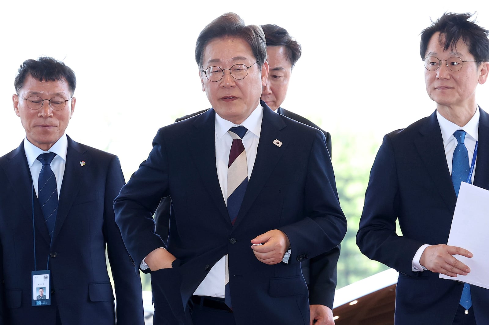 South Korean new President Lee Jae-myung, center, arrives at presidential office in Seoul after the inauguration Wednesday, June 4, 2025. (Chung Sung-Jun/Pool Photo via AP)