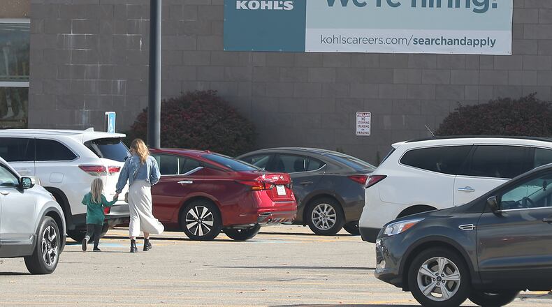 A large sign on the front of Kohl's on North Bechtle Avenue letting people know they're hiring. BILL LACKEY/STAFF