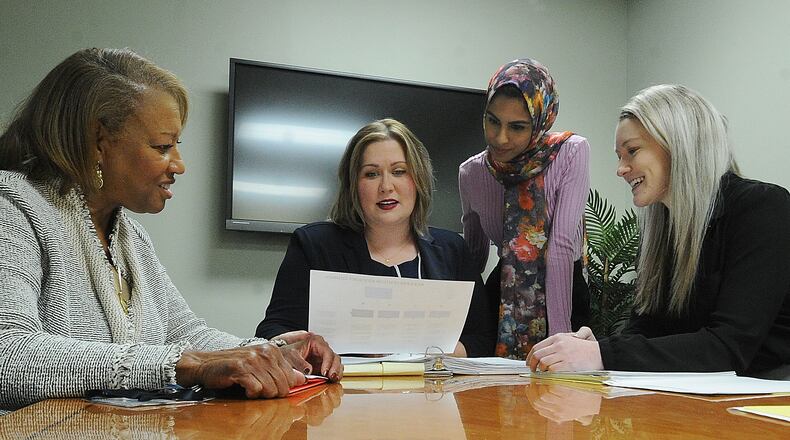 The Montgomery County ADAMHS Board received a $400,000 grant to help promote Black youth mental health. From left, Helen E. Jones-Kelley, Danielle Zeisloft, Tazeen Ahmed and Tristyn Ball will oversee and administer the grant. MARSHALL GORBY\STAFF