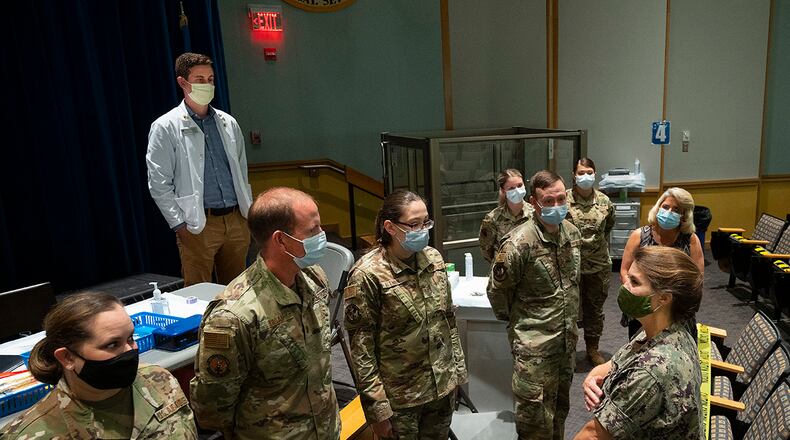 Rear Adm. Kristen Fabry (right), Defense Logistics Agency Land and Maritime commander, visits with a team of 88th Medical Group Airmen in October at Wright-Patterson Medical Center. U.S. AIR FORCE PHOTO/R.J. ORIEZ