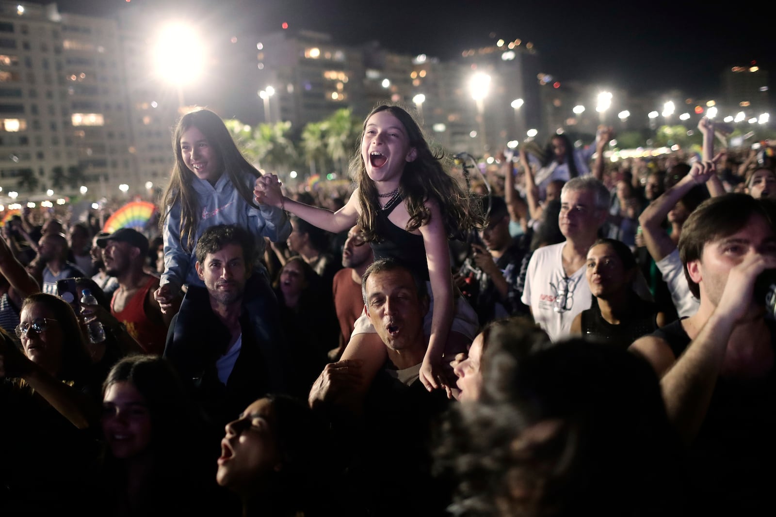 Fans cheer as they watch Lady Gaga free concert on Copacabana beach, in Rio de Janeiro, Sunday, May 4, 2025. (AP Photo/Bruna Prado)