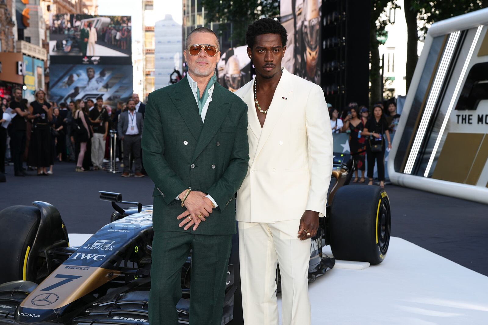 Brad Pitt, left, and Damson Idris pose for photographers upon arrival at the premiere of the film 'F1 The Movie' on Monday, June 23, 2025, in London. (Photo by Scott A Garfitt/Invision/AP)