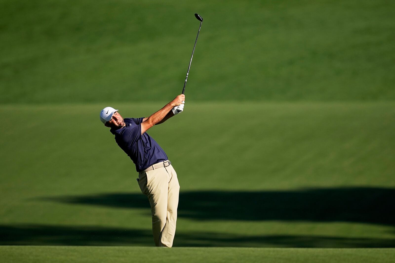 Scottie Scheffler hits from the fairway on the 15th hole during the final round of the PGA Championship golf tournament at the Quail Hollow Club, Sunday, May 18, 2025, in Charlotte, N.C. (AP Photo/David J. Phillip)