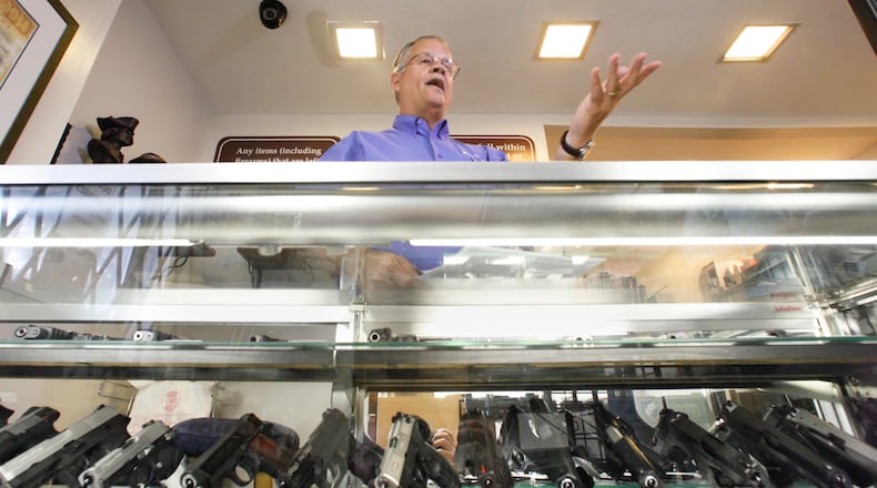 John Thyne, owner of Peabody Sports in Clearcreek Twp., Warren County, is a federally licensed dealer. Here, he discusses gun background checks and internet sales of firearms. CHRIS STEWART / STAFF