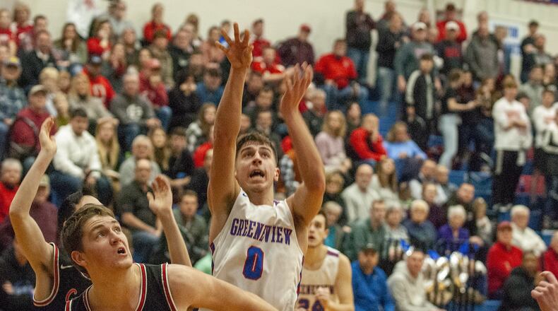 Greeneview senior Gabe Caudill shoots over Cedarville’s Hunter Baldwin during Friday night’s game at Greeneview. Caudill scored 24 points to lead the Rams to a 58-56 victory. Jeff Gilbert/CONTRIBUTED