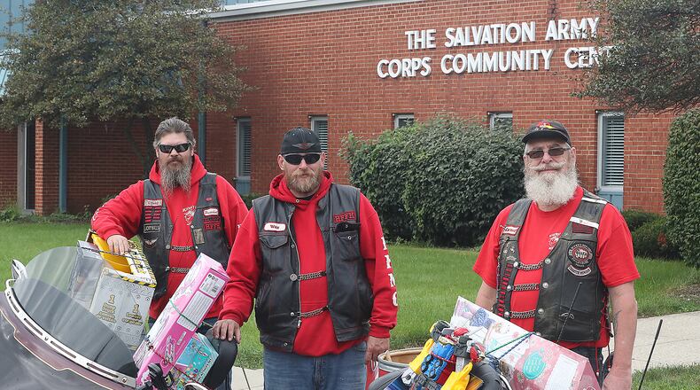 Barron Seelig, front, along with fellow Highway Hikers, Wax, and Lump, wanted to remind all the motorcycle riders and non-riders about the 43rd annual Highway Hikers Motorcycle Club Toy Run on Oct. 17. BILL LACKEY/STAFF