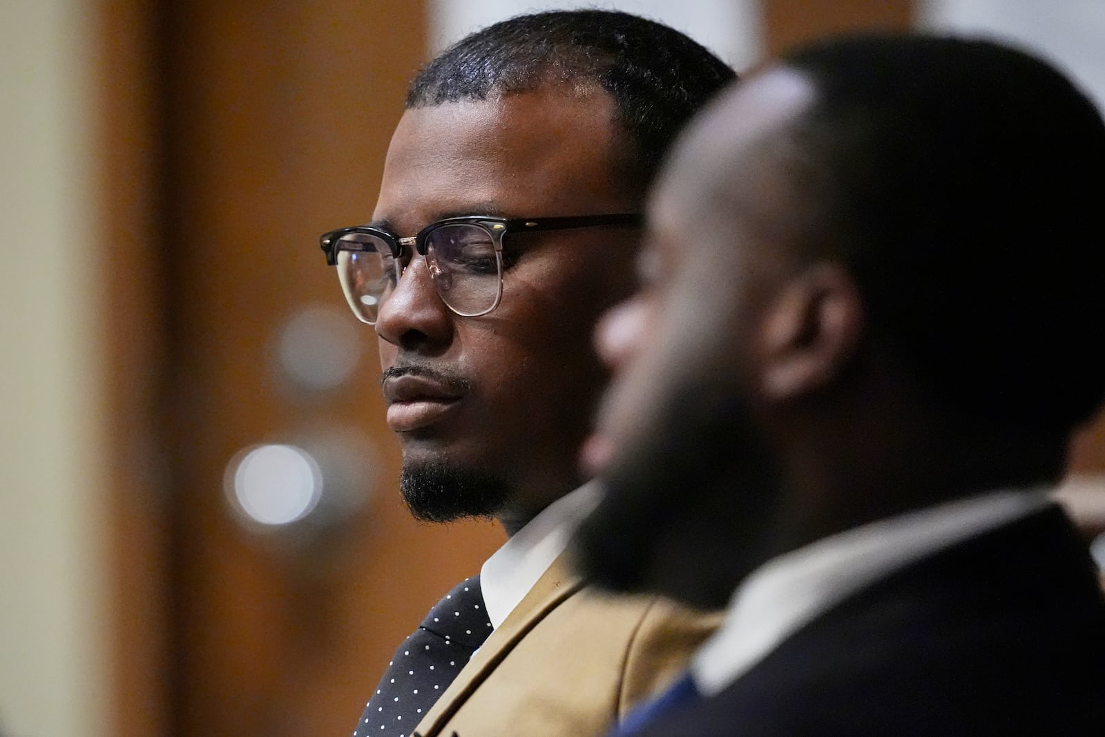 Former Memphis Police Officer Justin Smith Jr., left, sits in the courtroom Wednesday, April 30, 2025, during the state trial of Smith and two other former police officers accused in the 2023 death of Tyre Nichols, in Memphis, Tenn. (AP Photo/George Walker IV, Pool)