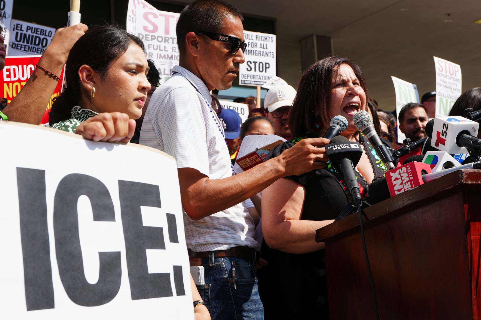 Angelica Salas, of The Coalition for Humane Immigrant Rights, speaks outside the Federal Building after federal immigration authorities conducted an operation on Friday, June 6, 2025, in Los Angeles. (AP Photo/Damian Dovarganes)
