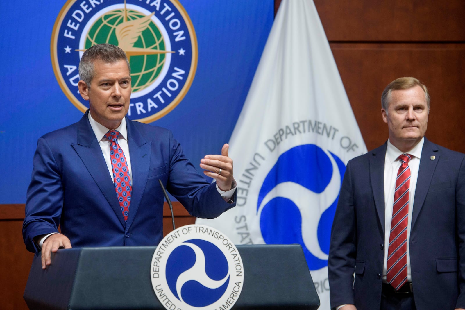 Acting FAA Administrator Chris Rocheleau, right, listens as Secretary of Transportation Sean Duffy speaks during a news conference to provide a status update on Newark Liberty International Airport at the Department of Transportation in Washington, Wednesday, May 28, 2025. (AP Photo/Rod Lamkey, Jr.)