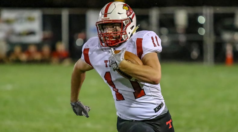 Triad High School junior JC Alexander rushes the ball for the Cardinals during their game against Southeastern on Friday night in South Charleston. The Cardinals won 18-14. CONTRIBUTED PHOTO BY MICHAEL COOPER