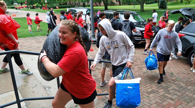 Wittenberg students and staff help incoming freshmen move there stuff into the dorms Thursday, August 24, 2023 during "Move-In Day" on campus. BILL LACKEY/STAFF