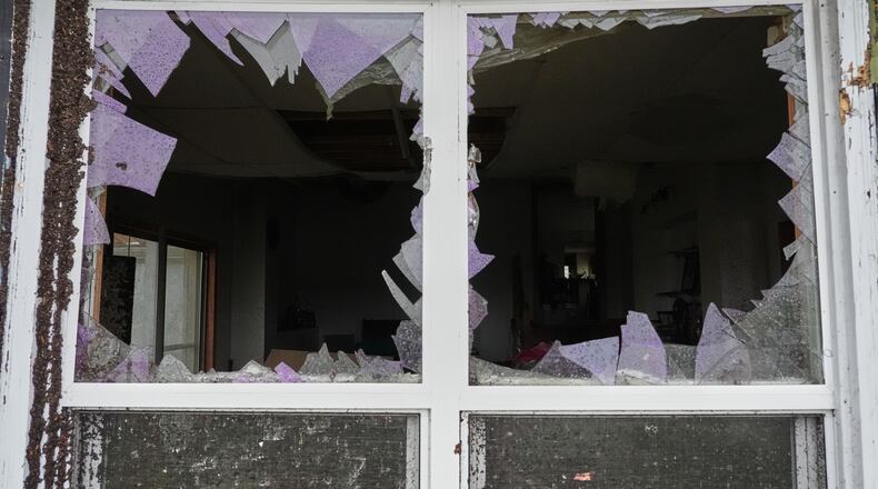 A window is damaged in the aftermath of a powerful storm that ripped through the area a day earlier in Kankakee, Ill., Wednesday, March 11, 2026. (AP Photo/Nam Y. Huh)