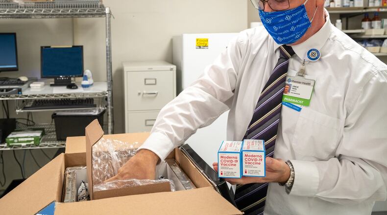 Upper Valley Medical Center in Troy received 600 doses of the Moderna coronavirus vaccine Monday morning. Vince Yahl, the pharmacy site manager at Upper Valley, unpacks the doses. JIM NOELKER/STAFF