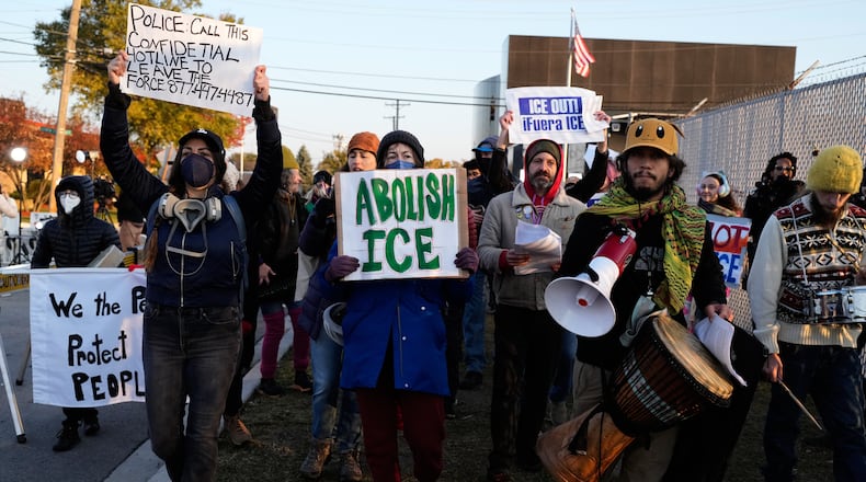 Protesters gather outside an ICE processing facility in the Chicago suburb of Broadview, Ill., Friday, Oct. 31, 2025. (AP Photo/Nam Y. Huh)