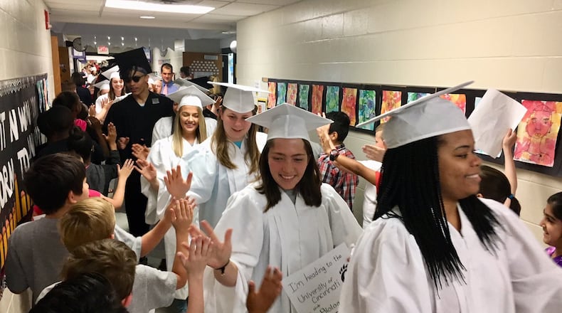 Dozens of graduating Lakota East High School seniors paraded through cheering youngsters at Woodland Elementary recently as part of a recent and popular spring tradition at Lakota Schools. All 10 of Lakota’s elementary schools put on parades for seniors from both Lakota East and Lakota West.