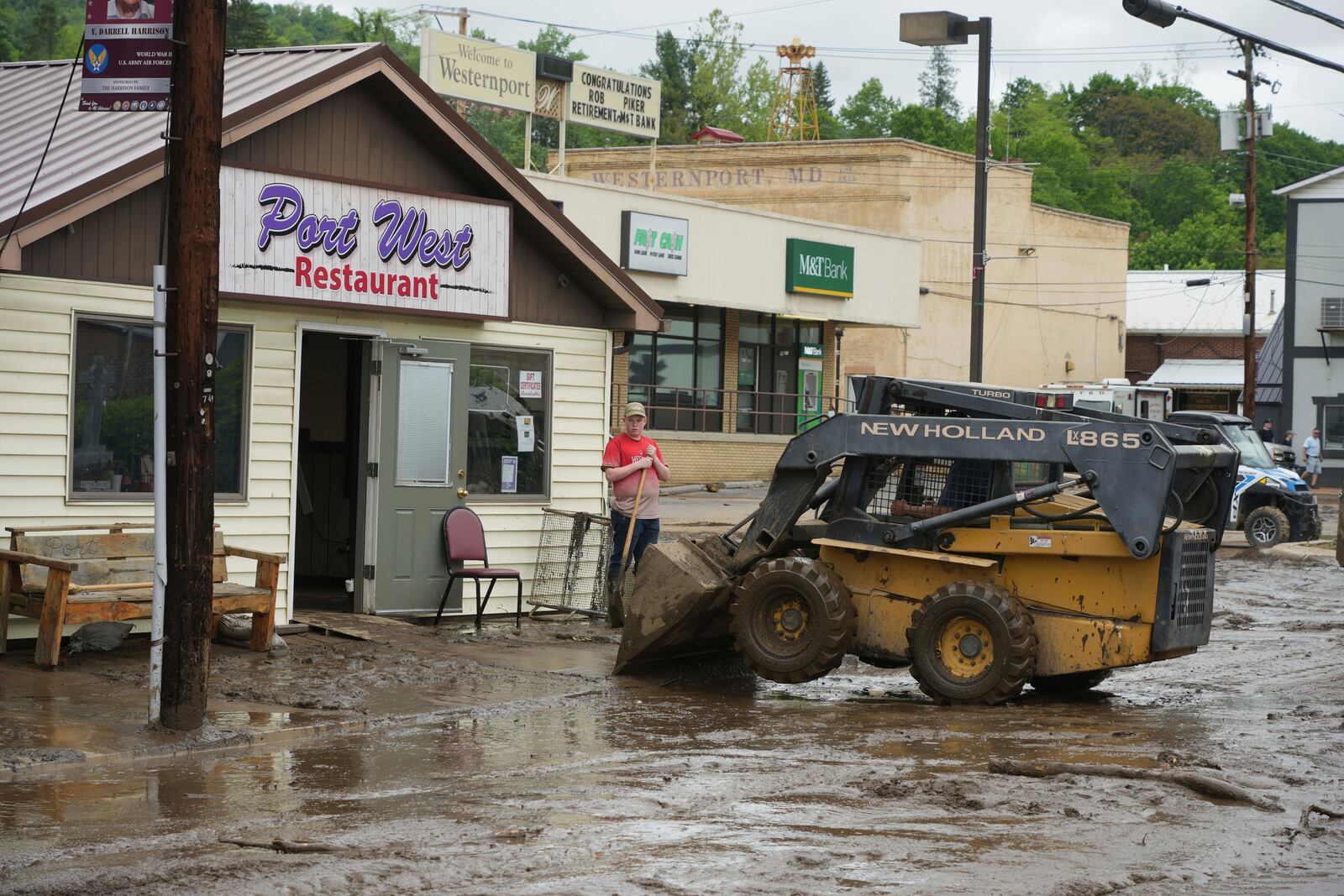 Clean up continues on Main Street after flooding on Wednesday, May 14, 2025 in Westernport, Md. (AP Photo/Gene J. Puskar)
