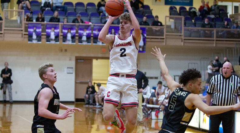 Cedarville senior Trent Koning shoots over Botkins' Jayden Priddy-Powell (5) and Zane Paul during Friday night's Division IV region final at Butler High School. Koning scored 14 points, but the Indians lost 42-40. Jeff Gilbert/CONTRIBUTED