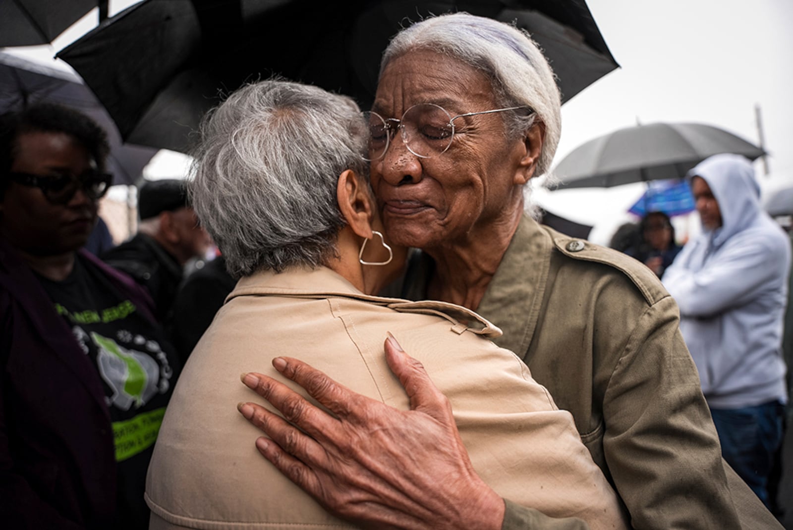 Amina Baraka, mother of Newark Mayor Ras J. Baraka, hugs Rep. Bonnie Watson Coleman, D-N.J., outside of an ICE office after her son's arrest, Friday, May 9, 2025, in Newark, N.J. (AP Photo/Angelina Katsanis)