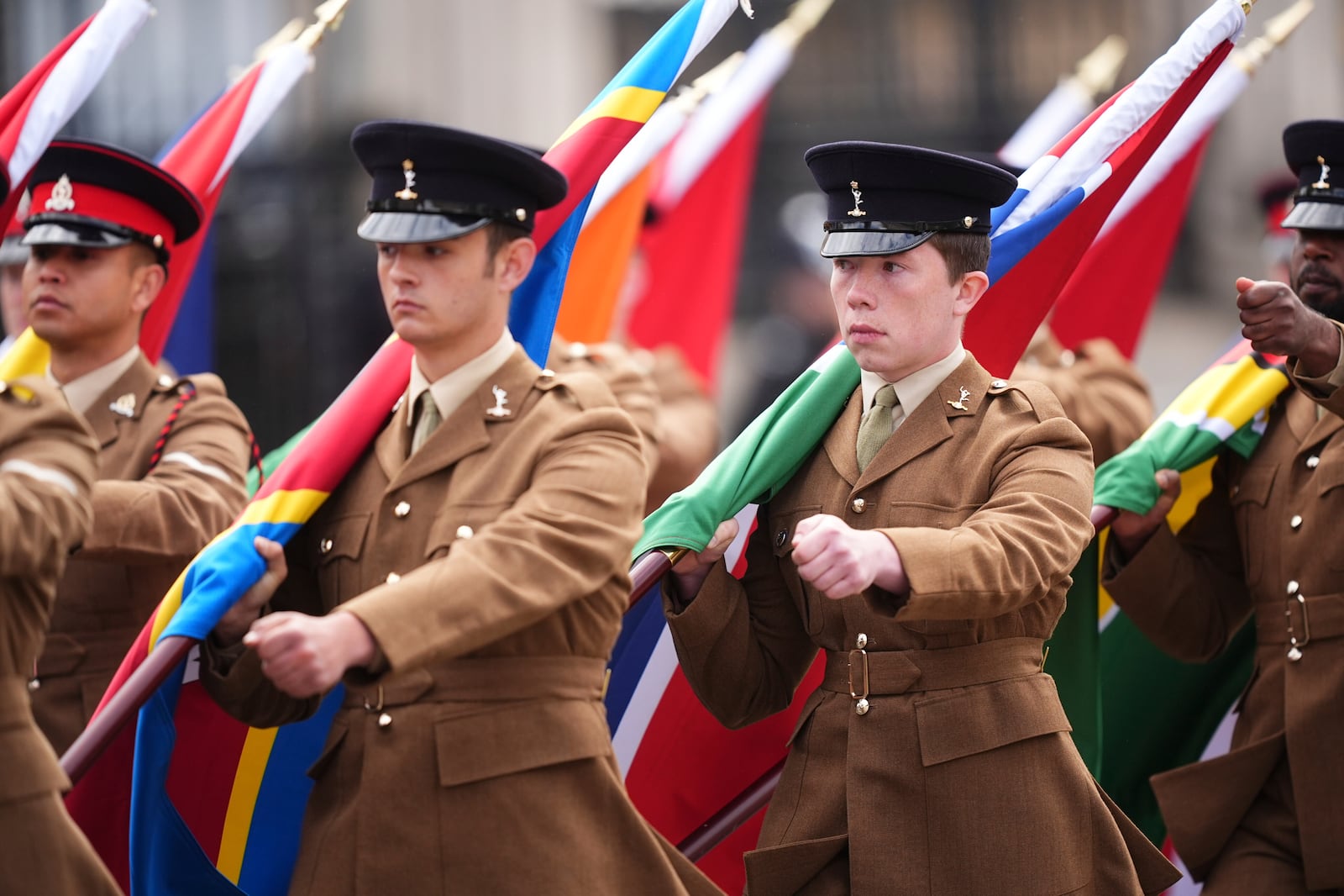 Members of the Colour Party carry flags of the Commonwealth nations , during the VE Day 80th anniversary parade, in London, Monday, May 5, 2025. (James Manning/Pool Photo via AP)