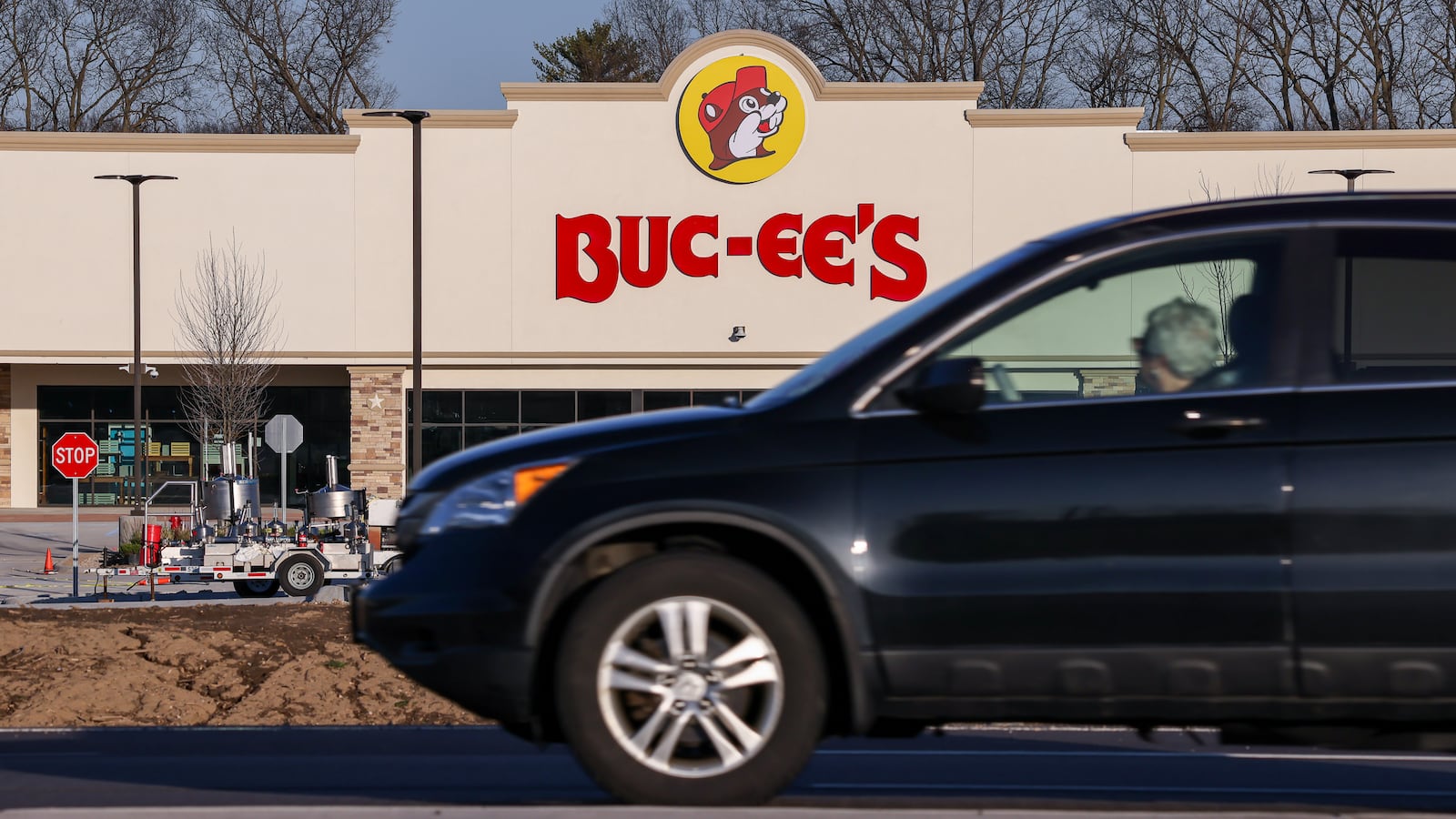 A woman looks toward Buc-ee's in Huber Heights near the Interstate 70 and Ohio 235 interchange. The superstation is scheduled to open to the public on April 6. Recent infrastructure upgrades in the area include lane widening, new traffic signals and the opening of Buc-ee's Boulevard. BRYANT BILLING / STAFF