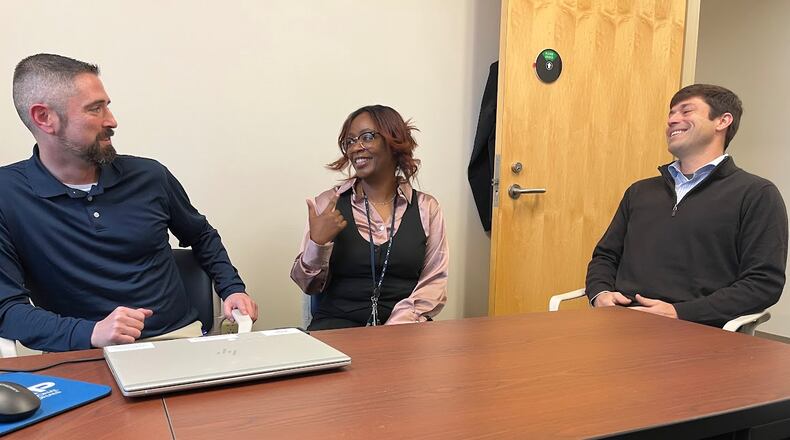 From left: Erick Burke, a Centerville resident and a U.S. army veteran; Taleisa Jones, a counselor for the Dayton VA vocational rehabilitation program; and Kevin Fields, vocational rehabilitation program manager at the Dayton VA campus. THOMAS GNAU/STAFF