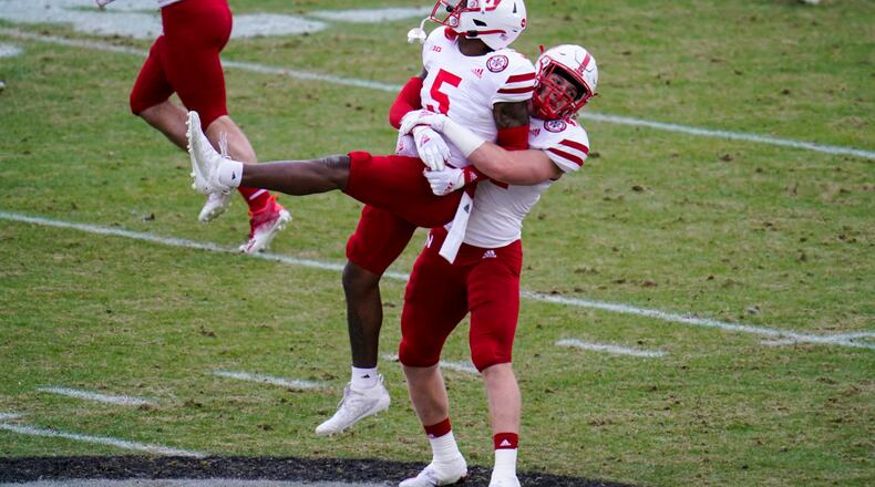Nebraska cornerback Cam Taylor-Britt (5) and linebacker Garrett Nelson (44) celebrate a stop on fourth down against Purdue during the second quarter of an NCAA college football game in West Lafayette, Ind., Saturday, Dec. 5, 2020. (AP Photo/Michael Conroy)