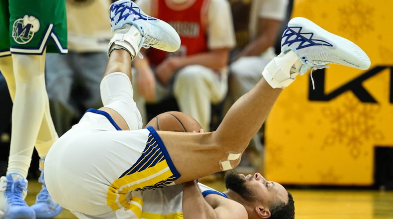 Golden State Warriors guard Stephen Curry reacts after getting fouled by the Dallas Mavericks during the first half of an NBA basketball game, Thursday, Dec. 25, 2025, in San Francisco. (AP Photo/Eakin Howard)