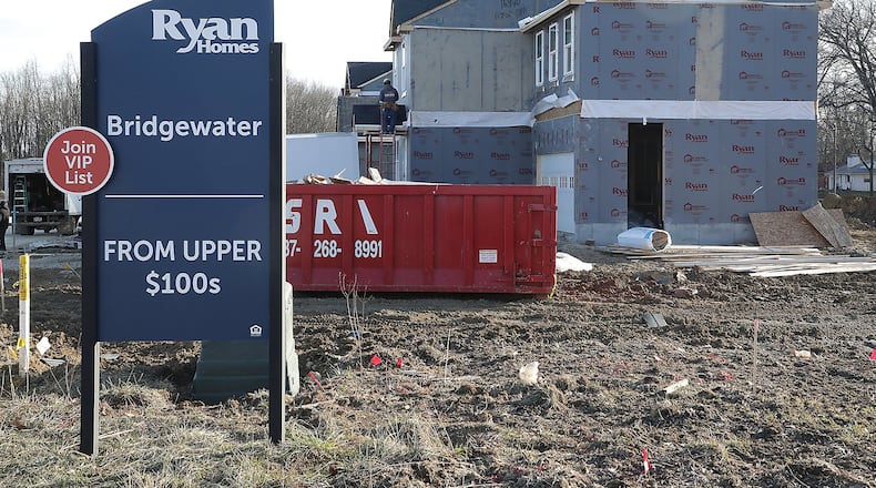 Homes are starting to spring up at the Bridgewater subdivision on Tuttle Road. BILL LACKEY/STAFF