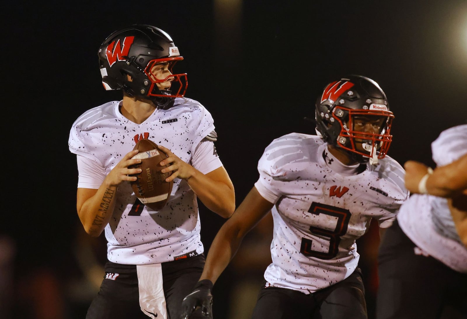 Lakota West quarterback Jackson Smith looks to pass during their football game against Fairfield Friday, Sept. 19, 2025 in Fairfield. The Indians won 10-7. NICK GRAHAM/STAFF