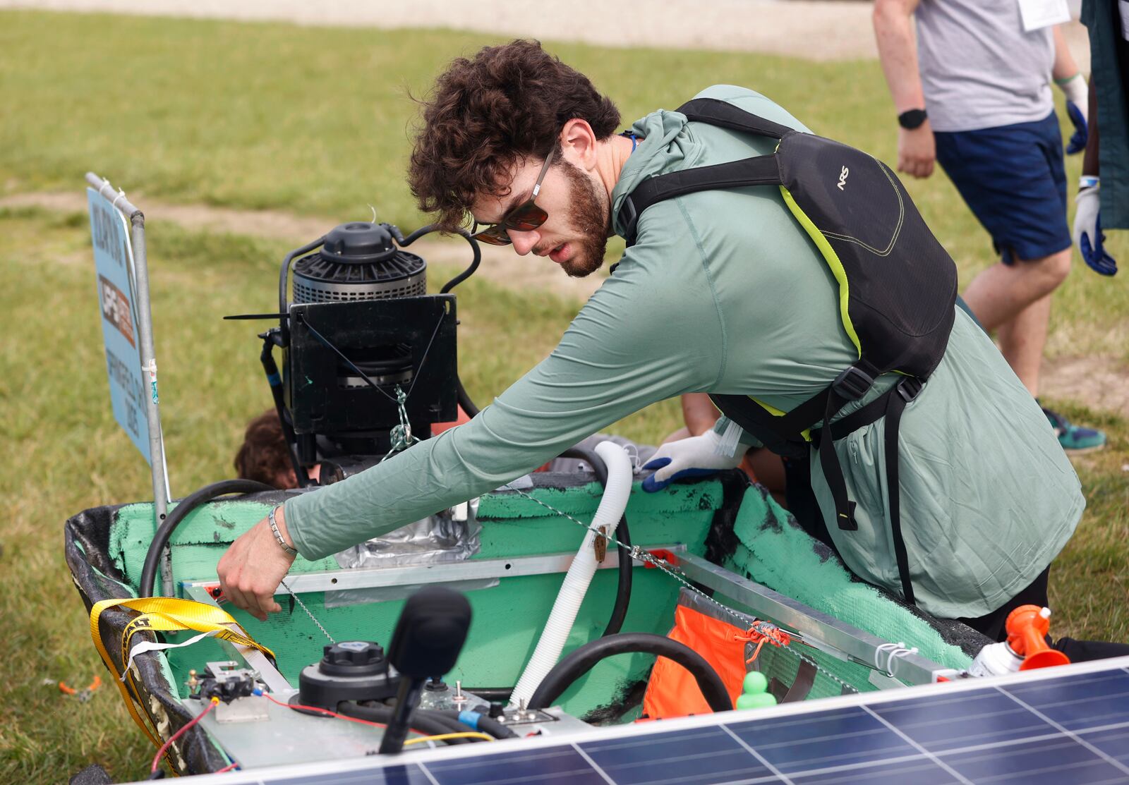 Liam Kaschner, a rising sophomore at Cal Poly Pomona, adjusts the inside of a boat before using it for slalom round 1 of the Solar Splash on Thursday, June 5, 2025, at Clark County Fairgrounds Championships Park Lake. JOSEPH COOKE/STAFF