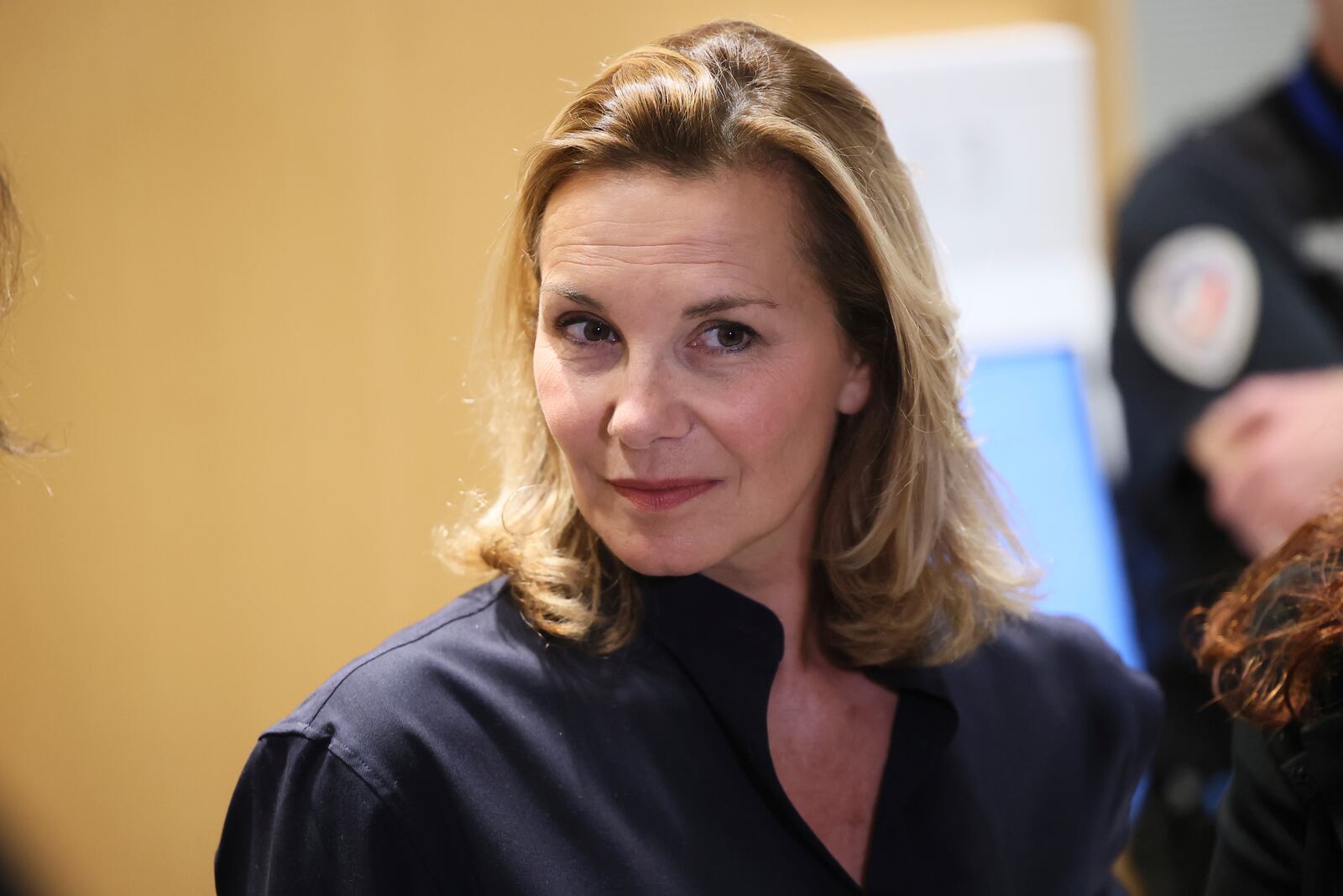 A plaintiff speaks with the media outside a Paris court, after a verdict was delivered on accusations that French actor Gerard Depardieu sexually assaulted two women who were working on a film with him in 2021, in Paris, Tuesday, May 13, 2025. (AP Photo/Thomas Padilla)