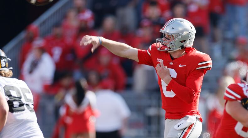 Ohio State quarterback Kyle McCord throws a pass against Iowa during the second half of an NCAA college football game Saturday, Oct. 22, 2022, in Columbus, Ohio. (AP Photo/Jay LaPrete)