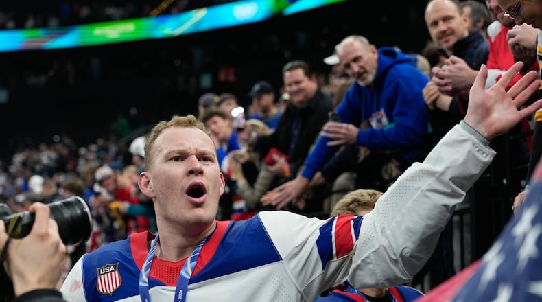 United States' Brady Tkachuk (7) celebrates after the United States defeated Canada in a men's ice hockey gold medal game between Canada and the United States at the 2026 Winter Olympics, in Milan, Italy, Sunday, Feb. 22, 2026. (AP Photo/Petr David Josek)