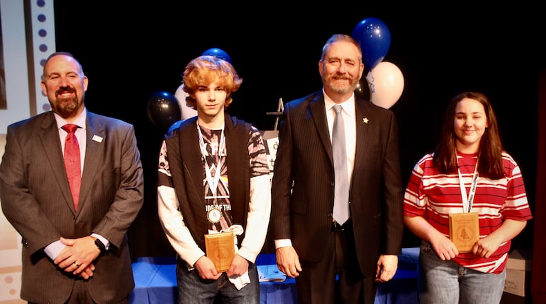 Roosevelt Middle School students Lily Hatton & Corbin Lambert along with Springfield City School District Superintendent Bob Hill and Ohio Attorney General Dave Yost during last year's Do the Write Thing challenge. Contributed/Springfield City School District.