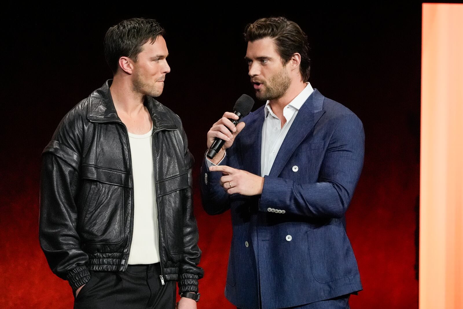 Nicholas Hoult, left, and David Corenswet, cast members of the upcoming film "Superman," speak during the Warner Bros. Pictures presentation at CinemaCon on Monday, April 1, 2025, at Caesars Palace in Las Vegas. (AP Photo/Chris Pizzello)