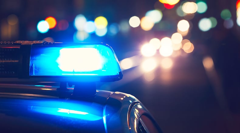 Police lights flash. FILE