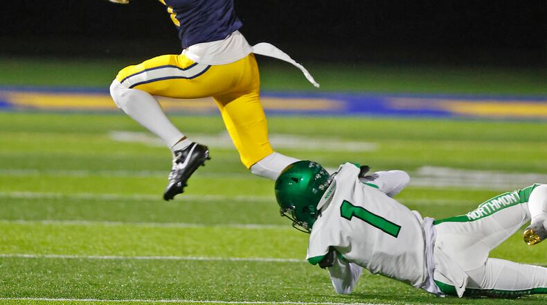 Springfield's Da'Shawn Martin tries to avoid a tackle by Northmont's Santana Keys during Friday's game. BILL LACKEY/STAFF